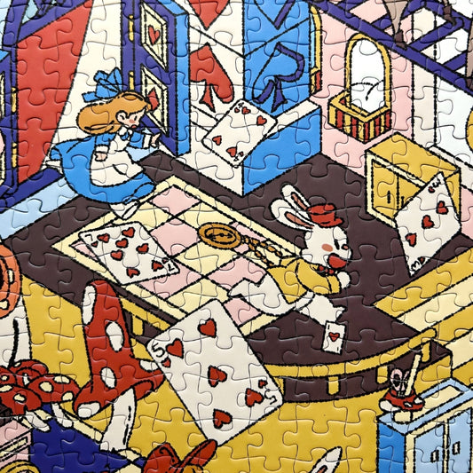 Close-up of Alice’s Wonderland puzzle showing Alice chasing playing cards and a rabbit in a detailed fantasy setting.