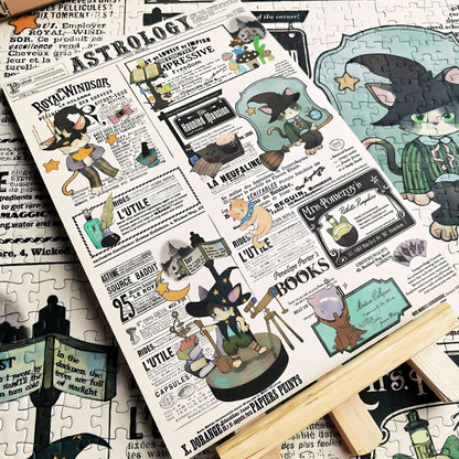 Close-up of Cat Astrology puzzle pieces assembled on a table, showing detailed illustrations of cats in astrologer costumes and vintage-style newspaper text.