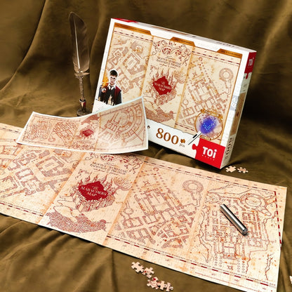 Harry Potter Marauder’s Map puzzle displayed flat with open box, glowing print, and replica map insert.