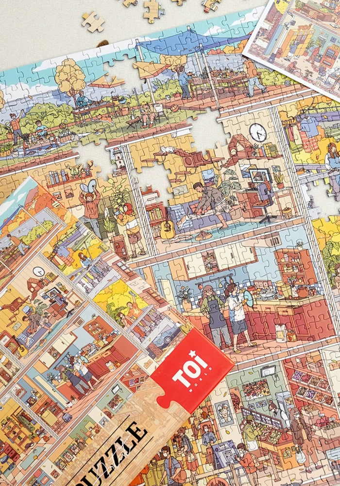 Close-up of the puzzle in progress with the box visible beside it.