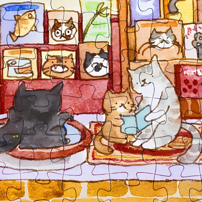 Close-up of assembled puzzle showing cats reading together