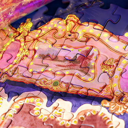 Close-up of puzzle pieces showing the intricate gold foil details on the carousel frame.