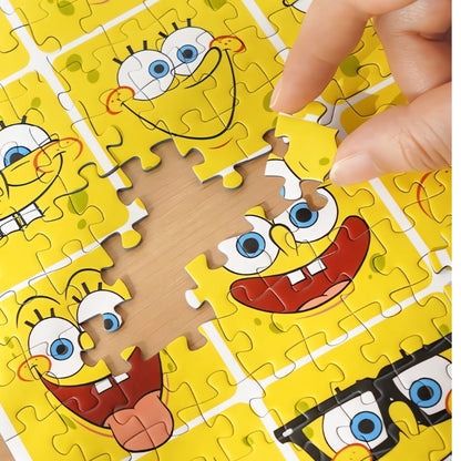 Close-up of hand placing a piece into the SpongeBob Mood Diary puzzle with bright yellow cartoon faces