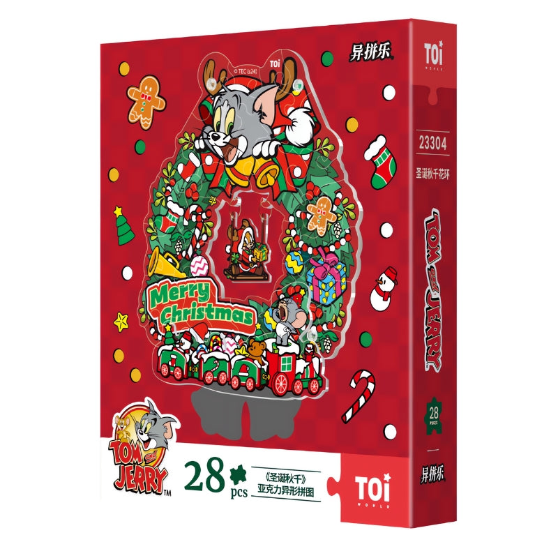 Red TOI puzzle box for the Tom and Jerry Christmas Swing Wreath acrylic puzzle with 28 pieces and festive graphics.