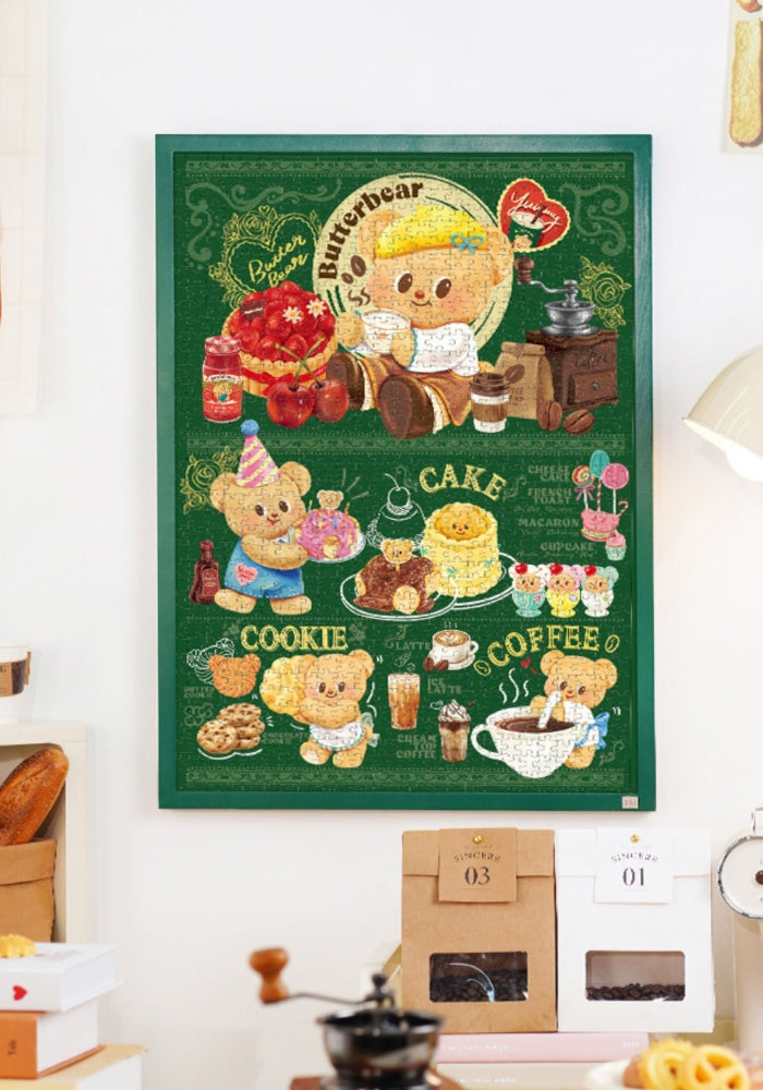 Framed Butterbear – Bearista Delights puzzle displayed on a wall, showing detailed café and dessert scenes.