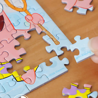 Puzzle piece being placed into Patrick-themed puzzle, highlighting the tight-fitting quality of the pieces.
