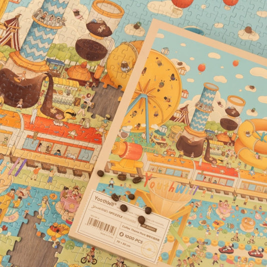 Puzzle detail showing coffee rides and biscuit Ferris wheel with product box.