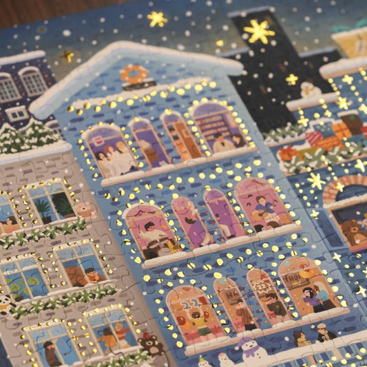 Close-up of puzzle section with foil lights and starry night sky.