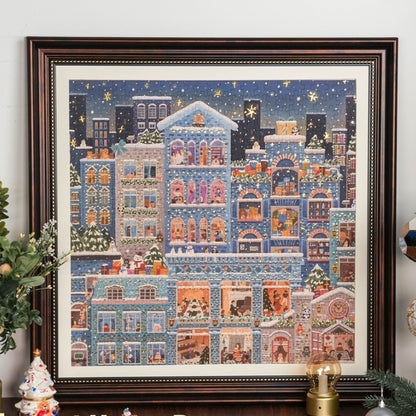 Framed Merry Snowy Night puzzle displayed against a white wall.