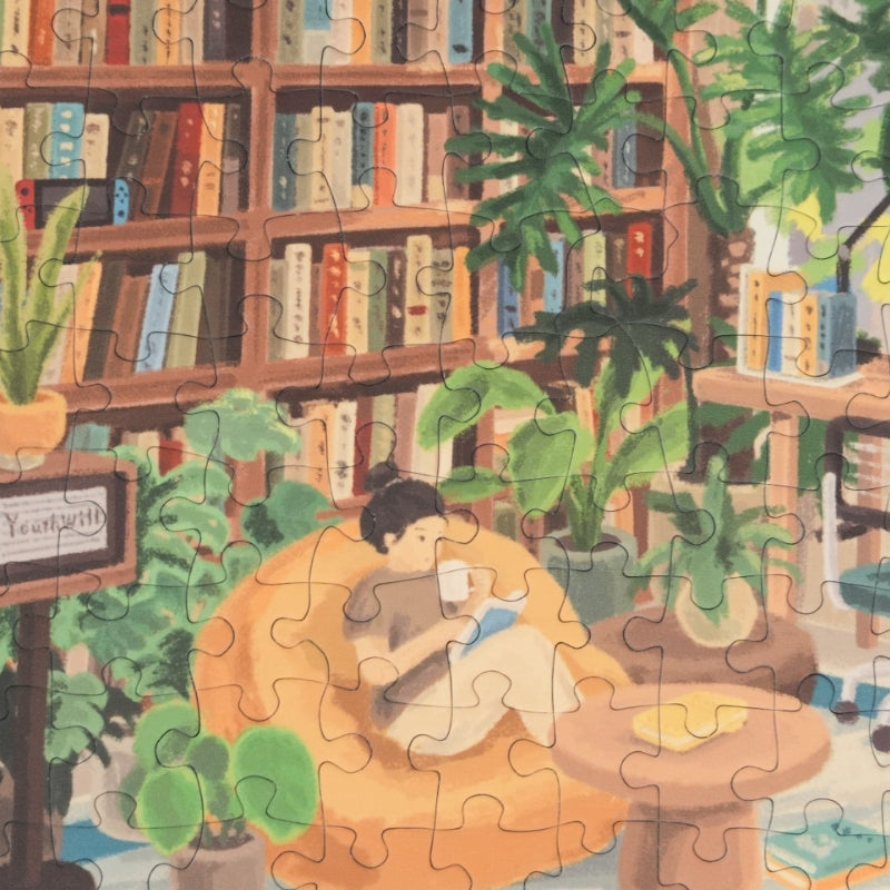 Puzzle detail showing person in bathtub, books, and cosy cabin decor.