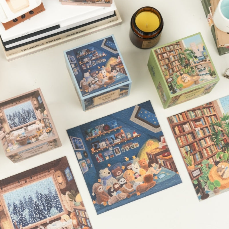 Flat lay showing Star Attic, Snowy Cabin, and Natural Room mini puzzles with boxes.